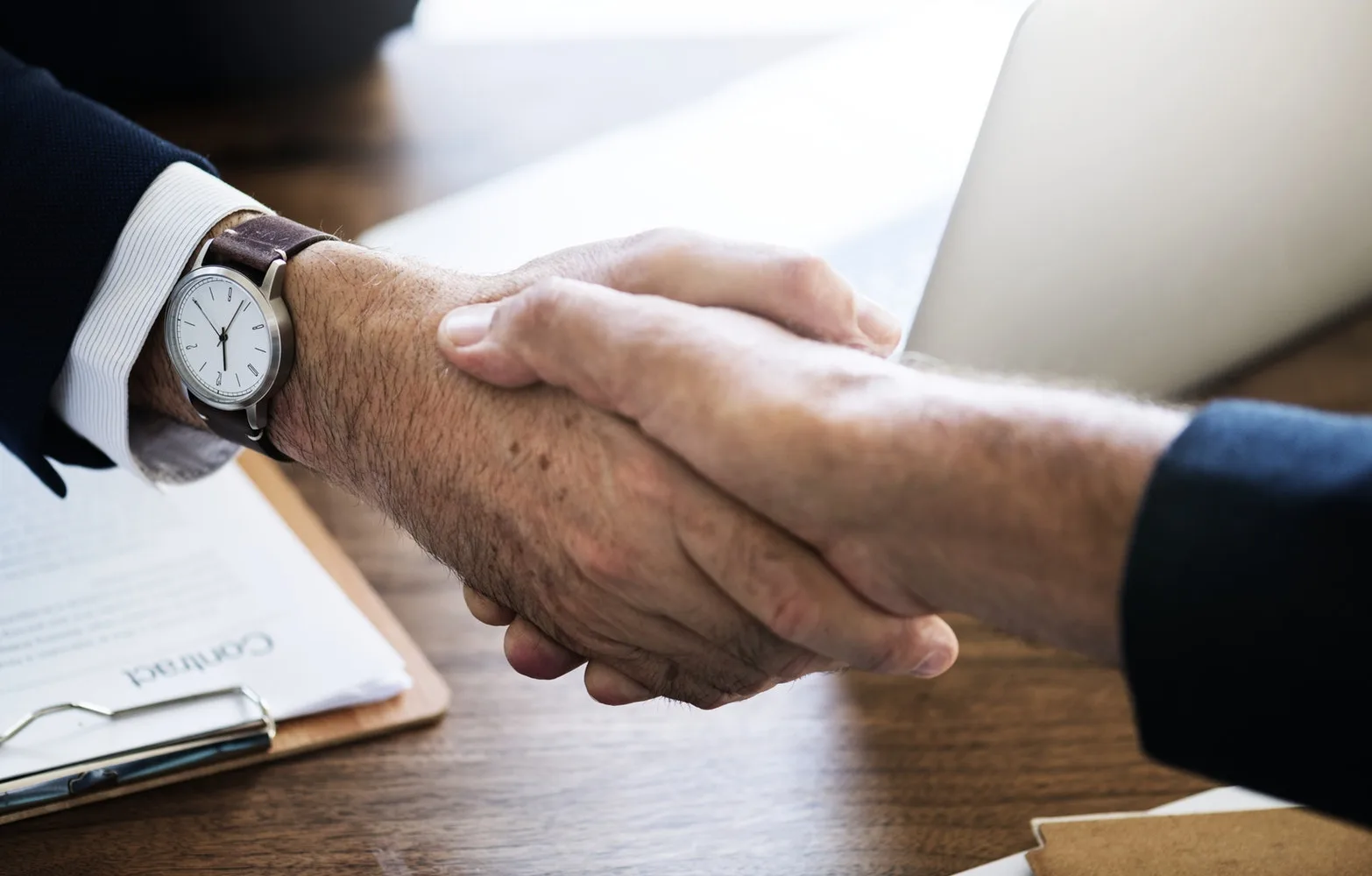 two businessman shaking hands